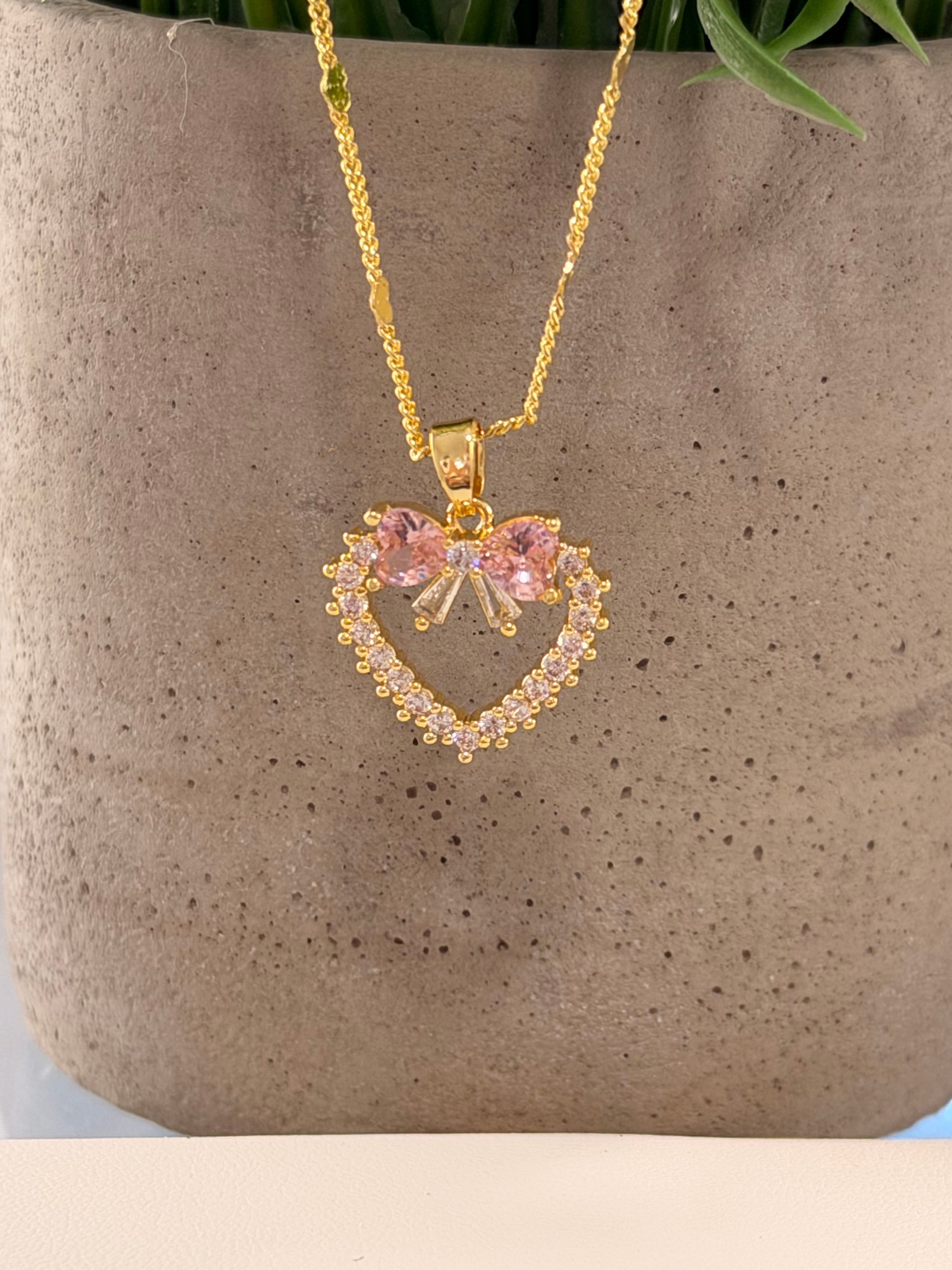 Cadena corazón moño rosa