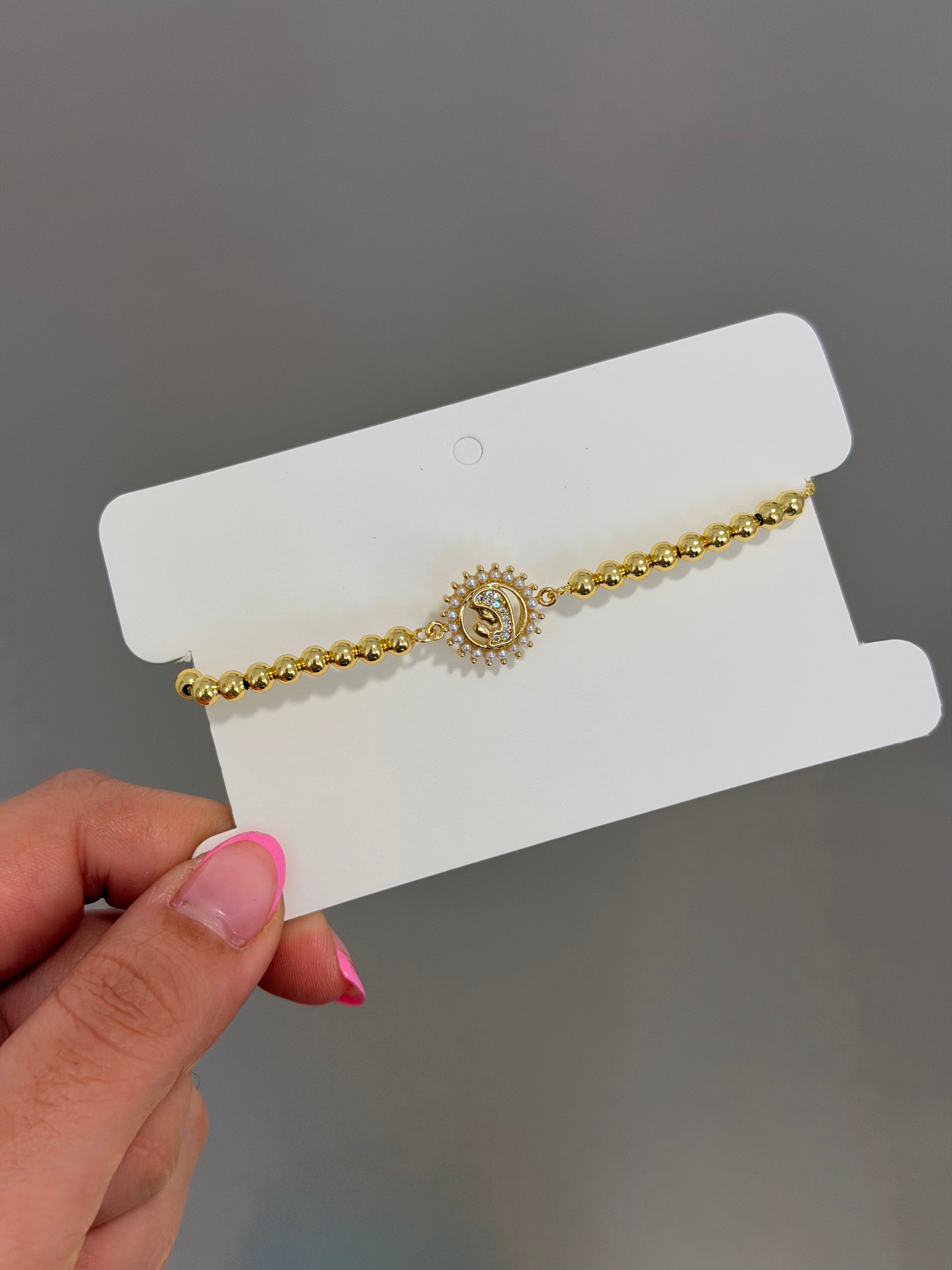Pulsera virgen manos